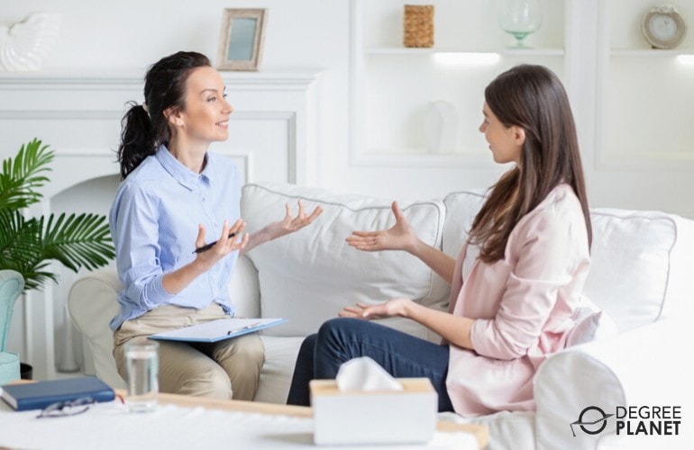 counselor talking to a client in her office