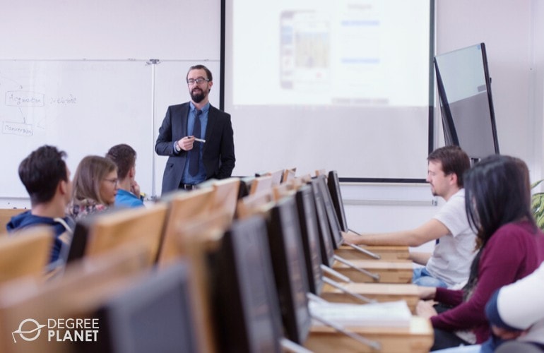 university professor teaching in a computer classroom