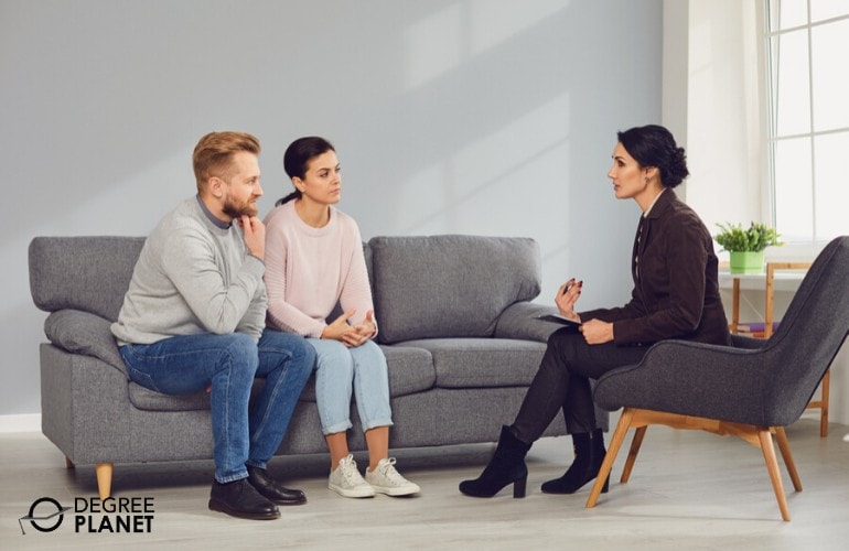 psychologist talking to a couple in her office